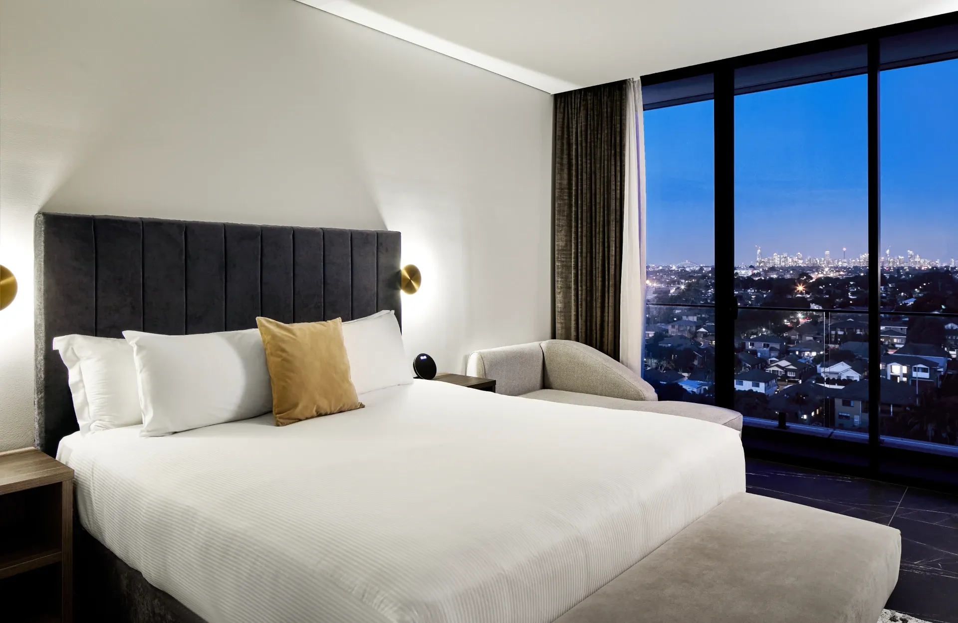 Guest room with a king bed and floor-to-ceiling windows at Crowne Plaza Sydney Burwood